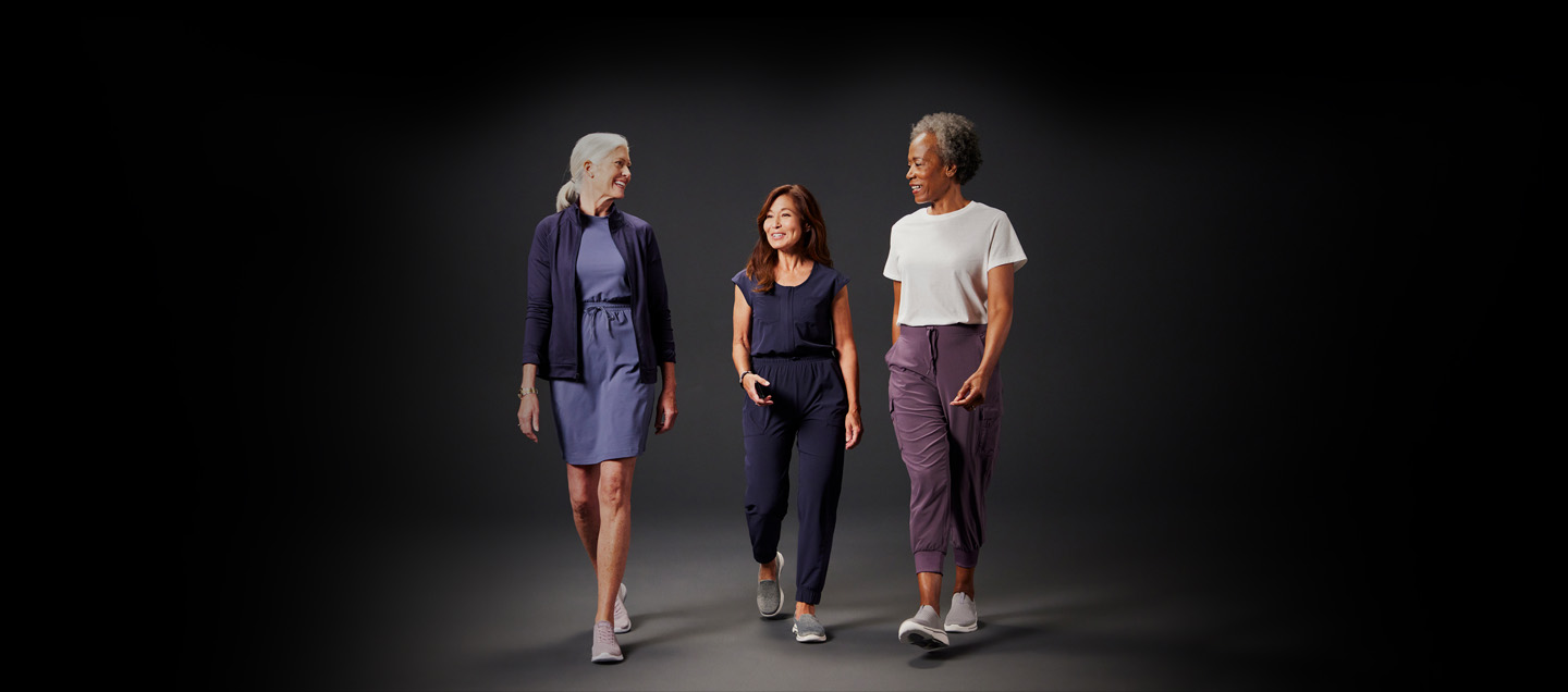 three women walking and talking