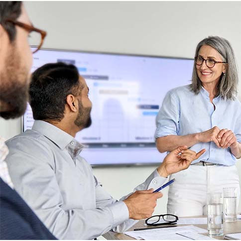 Professionals listening to a presentation.